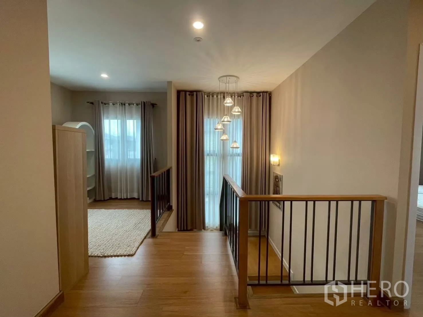 Detached House for rent in Bang Phli, Samut Prakan - Stair hall with pendant lights and black metal railing.