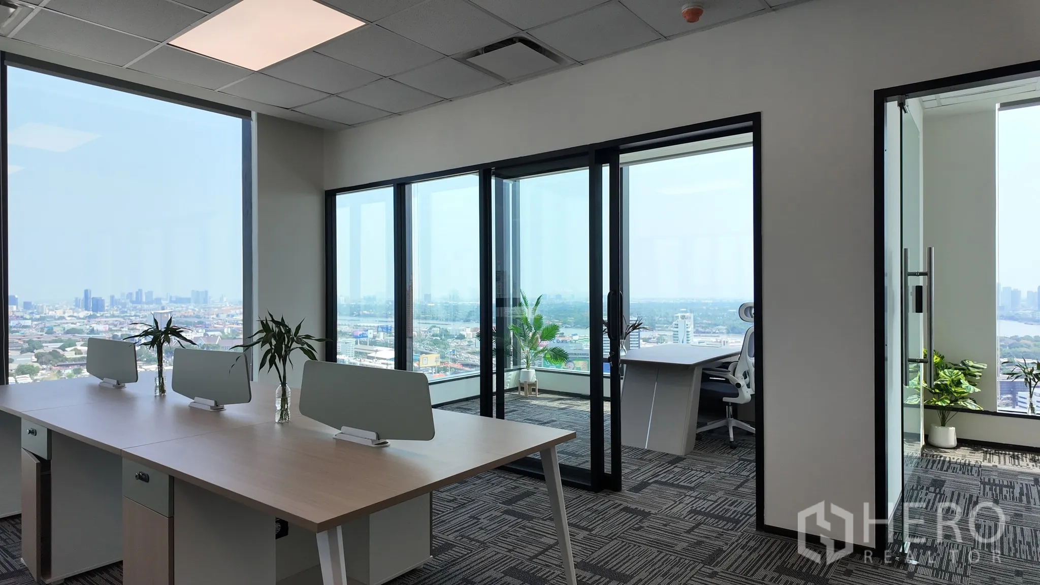 Office Space for rent in Khlong Toei, Bangkok - Open workspace leading to glass-partitioned offices with skyline views.