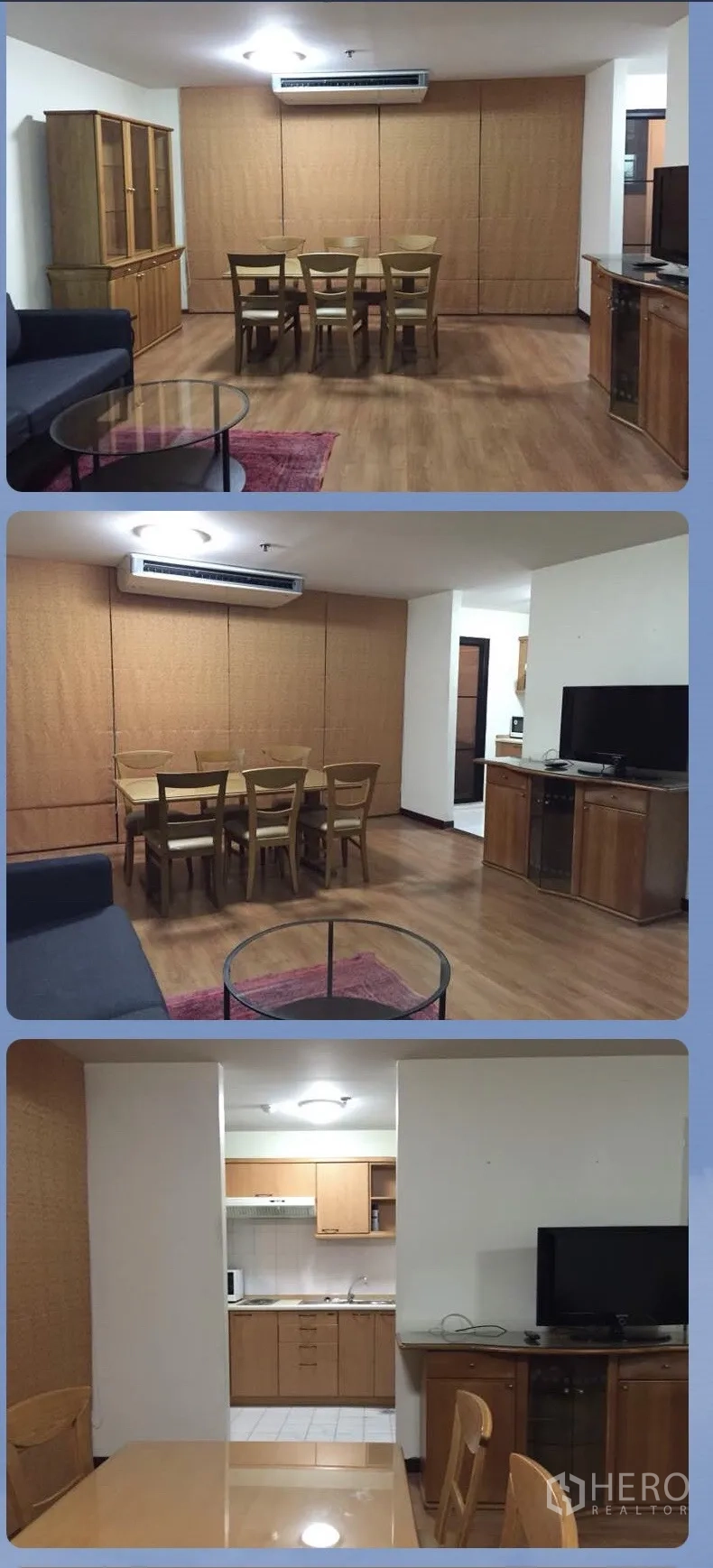 คอนโด ให้เช่าในWatthana, Bangkok - ห้องนั่งเล่นอบอุ่น โซฟาสีดำ เก้าอี้เอน โต๊ะกลางกระจก ชั้นวาง และงานศิลป์