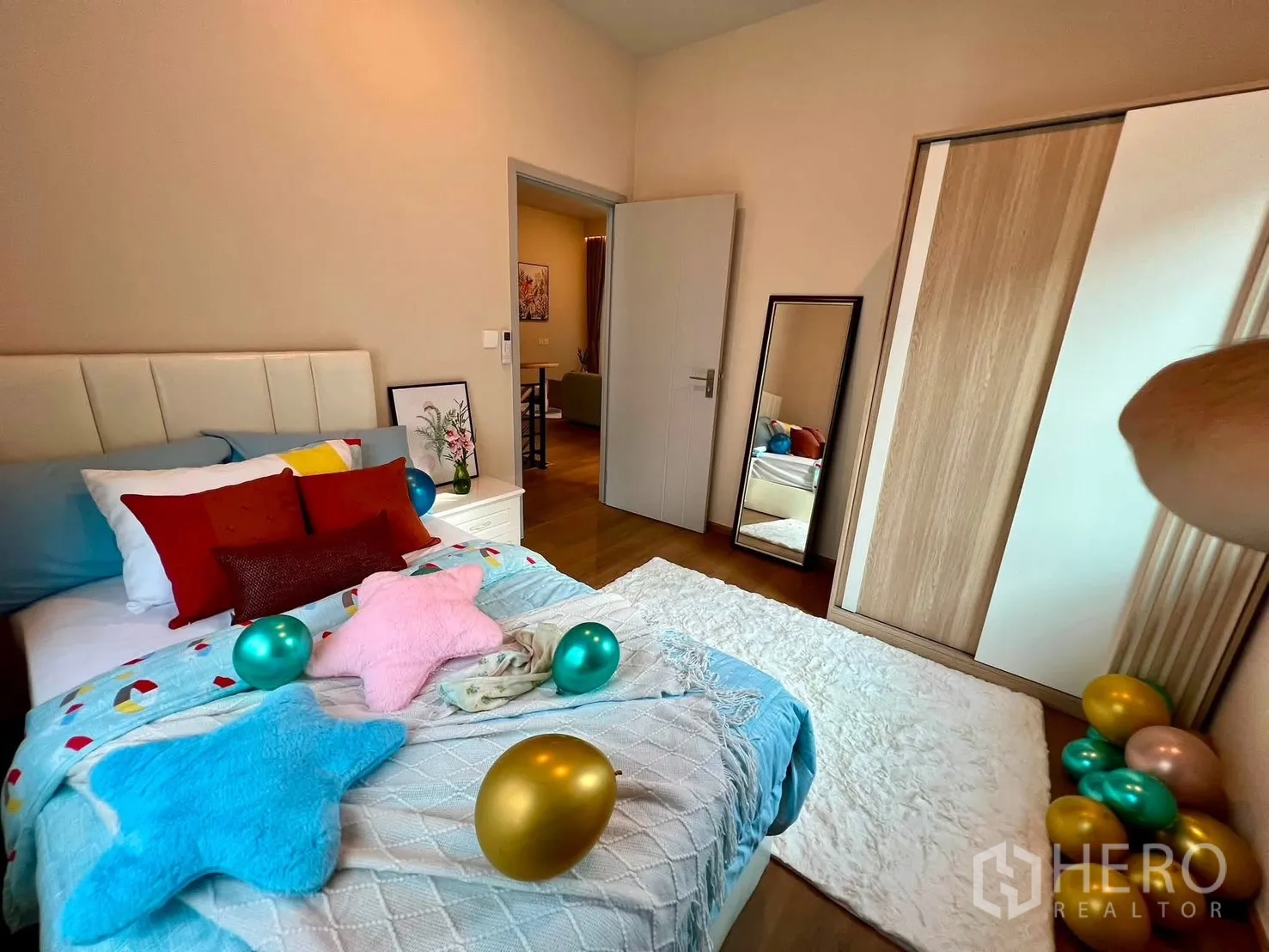 Detached House for rent in Bang Phli, Samut Prakan - Cozy bedroom with bed, wardrobe, and floor mirror.