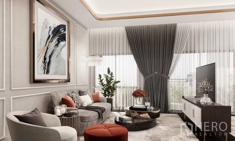 Detached House for sale in Prawet, Bangkok - Family living area with L-shaped sofa, coffee table and tall flowing curtains.