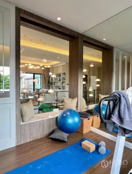 Detached House for sale in Bang Phli, Samut Prakan - Private fitness corner with yoga mat, exercise ball and large interior windows.