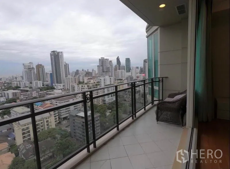 Condominium for rent in Watthana, Bangkok - Long balcony with glass railing overlooking high-rise cityscape.