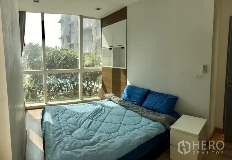 Condominium for rent or sale - Primary bedroom with floor-to-ceiling windows, pool view and built-in storage.