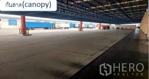 货栈 出租在Mueang Pathum Thani, Pathum Thani - 长跨度雨棚覆盖的全天候卡车装卸场。