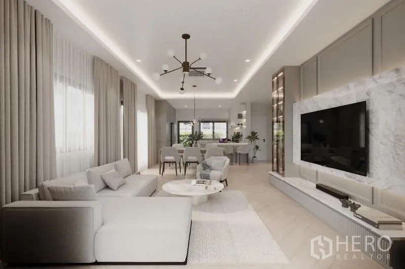 Detached House for rent in Bang Phli, Samut Prakan - Open-plan living and dining facing the kitchen and marble TV wall in a neutral palette.