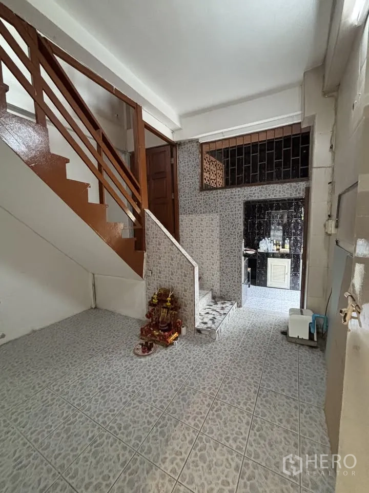 Retail Space for rent in Sathon, Bangkok - Rear area with tiled floors and a staircase leading to upper levels.