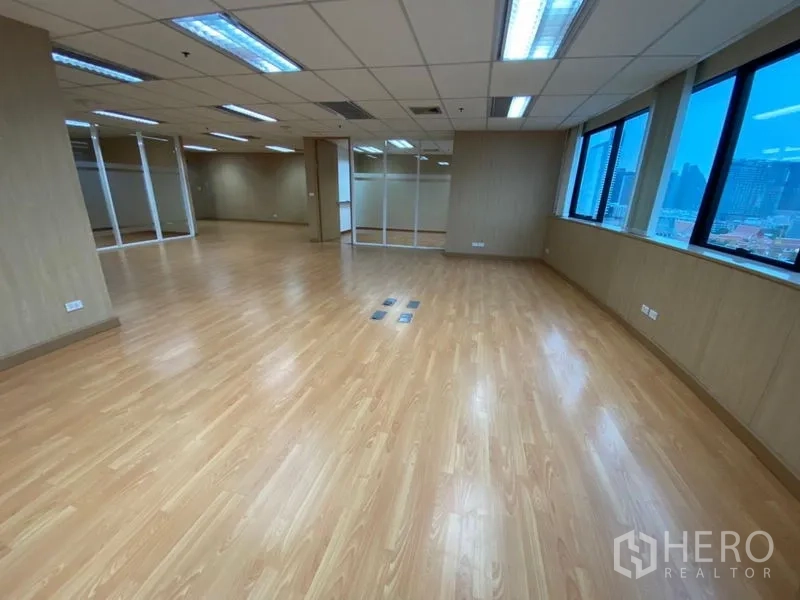 Office Space for rent in Watthana, Bangkok - Spacious corner office with multiple large windows, city views, and glass partitions.