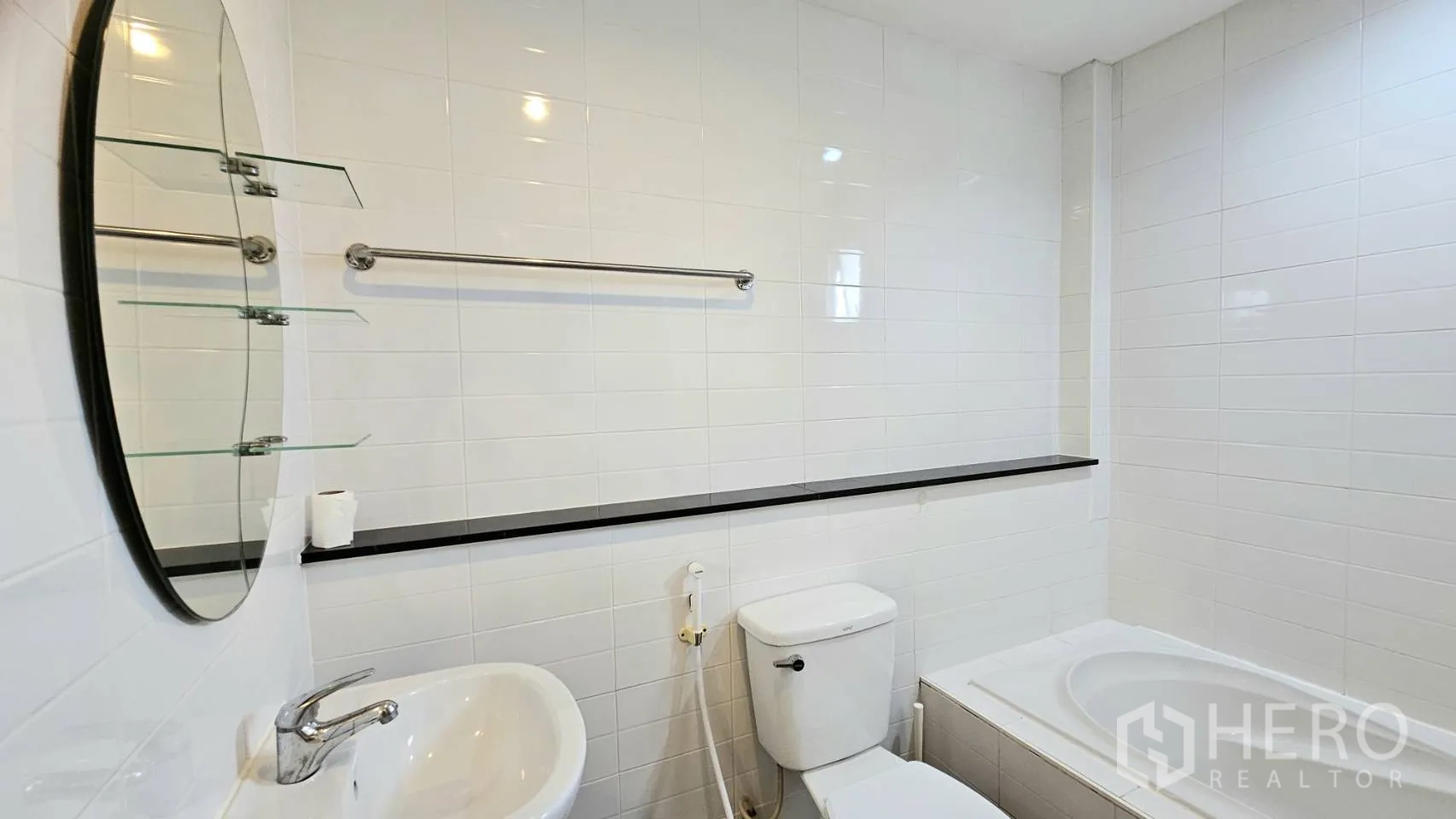 Detached House for rent in Saphan Sung, Bangkok - White-tiled bathroom with sink, toilet, and bathtub.