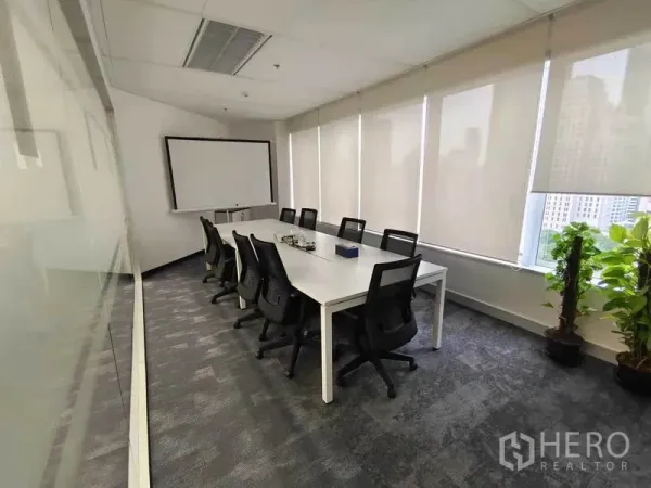 Office Space for rent in Pathum Wan, Bangkok - Glass-walled meeting room with long table, ergonomic chairs, whiteboard and city view.