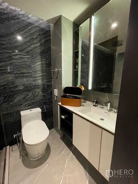 Condominium for rent or sale - Contemporary bathroom with illuminated vanity and toilet
