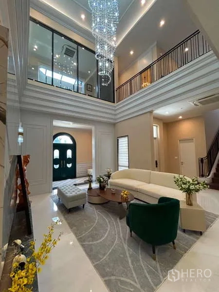 Detached House for sale in Bang Kapi, Bangkok - View from upper level showing dramatic crystal chandeliers over open living space.