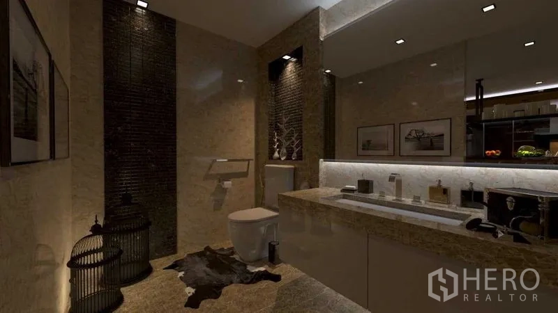 Shophouse for rent in Khlong San, Bangkok - Contemporary restroom featuring a long stone vanity, wall-mounted toilet and ambient lighting.