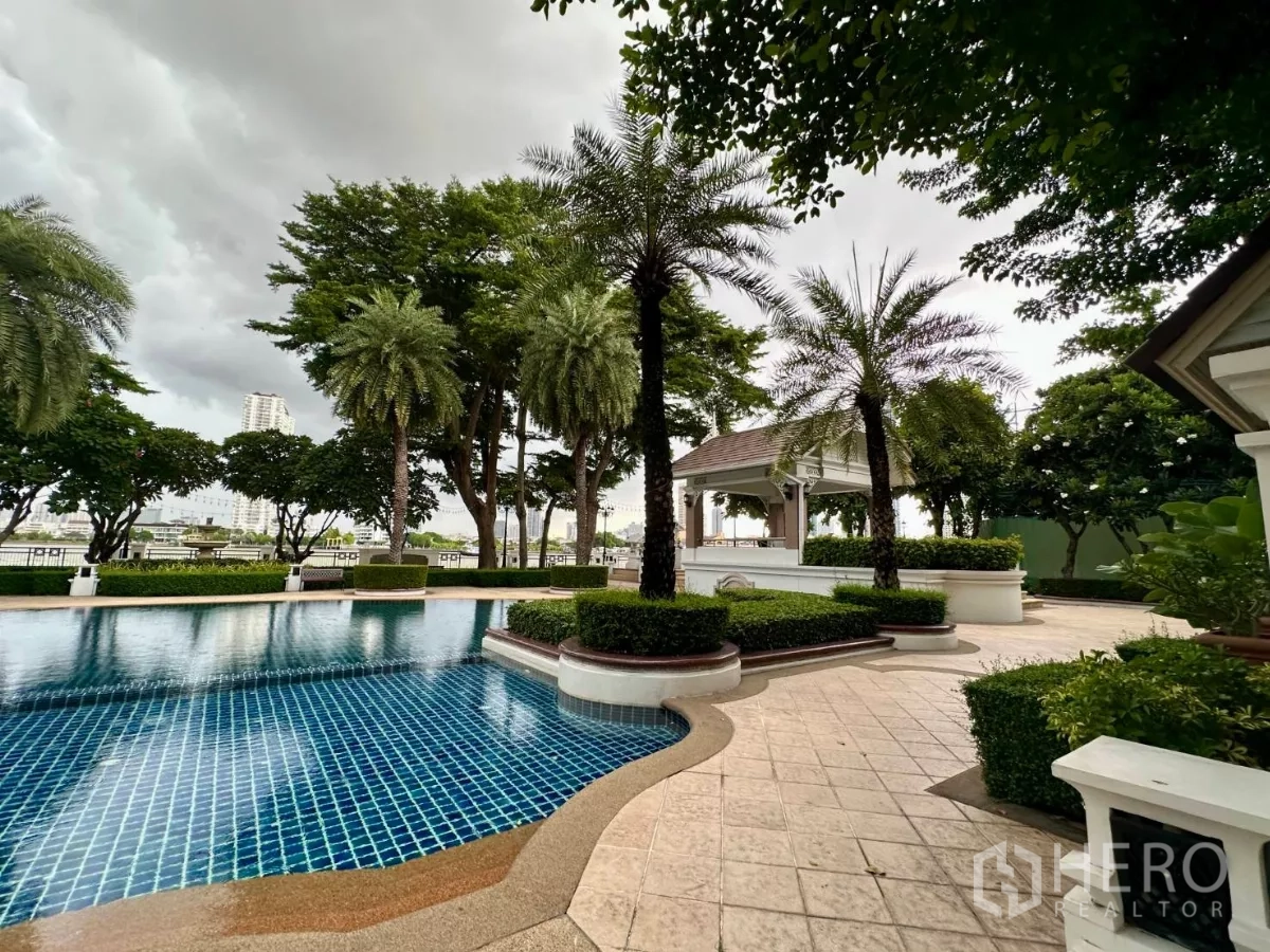 Townhouse for rent in Bang Kho Laem, Bangkok - Riverside estate swimming pool with pavilion, palm trees and landscaped gardens