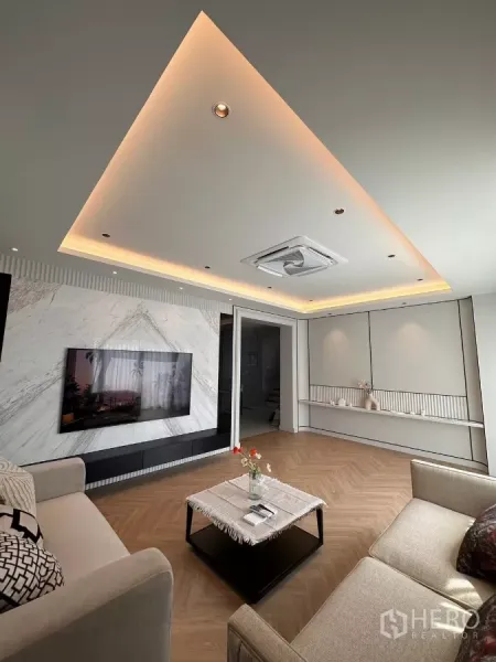 Detached House for rent in Bang Phli, Samut Prakan - Spacious lounge with herringbone floor, LED cove ceiling and feature TV wall.