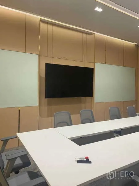 Office Space for rent in Huai Khwang, Bangkok - Boardroom wall with mounted flat-screen display, whiteboards and seating.