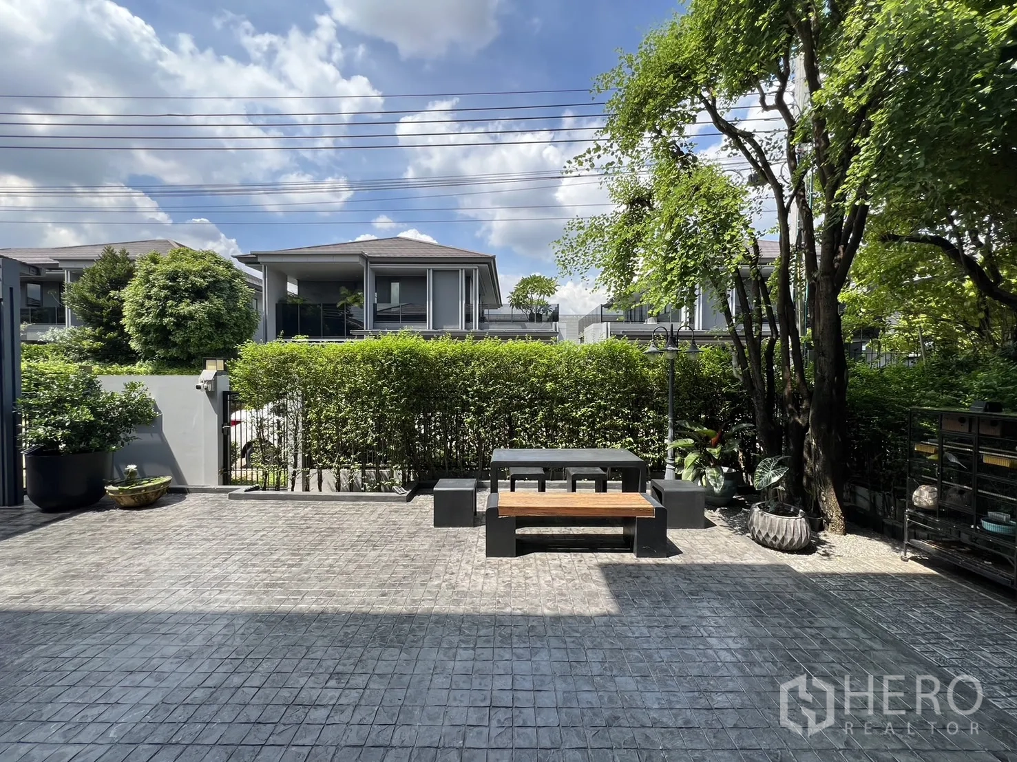 Detached House for rent or sale in Bang Kapi, Bangkok - Close view of modern facade with balcony and sliding doors.