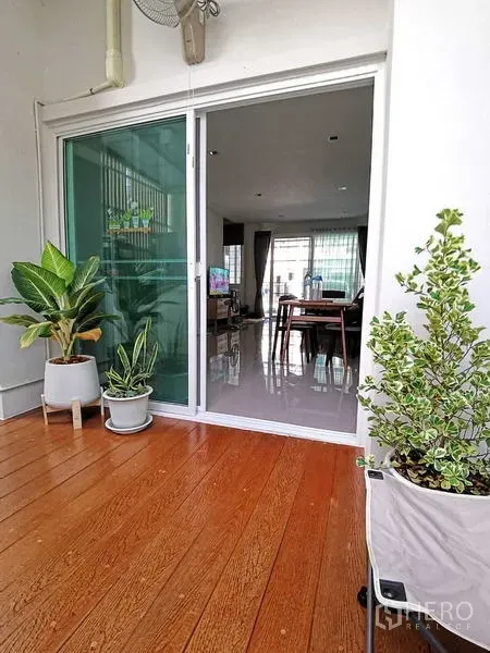 Home Office for rent or sale - Another view of the wood deck with potted plants beside sliding glass doors.