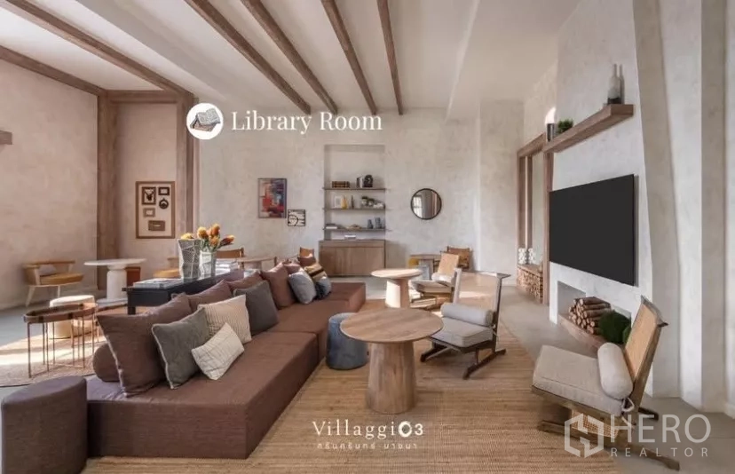 Townhouse for rent in Bang Phli, Samut Prakan - Library lounge with sofas, wood beams, coffee tables and TV wall for residents.