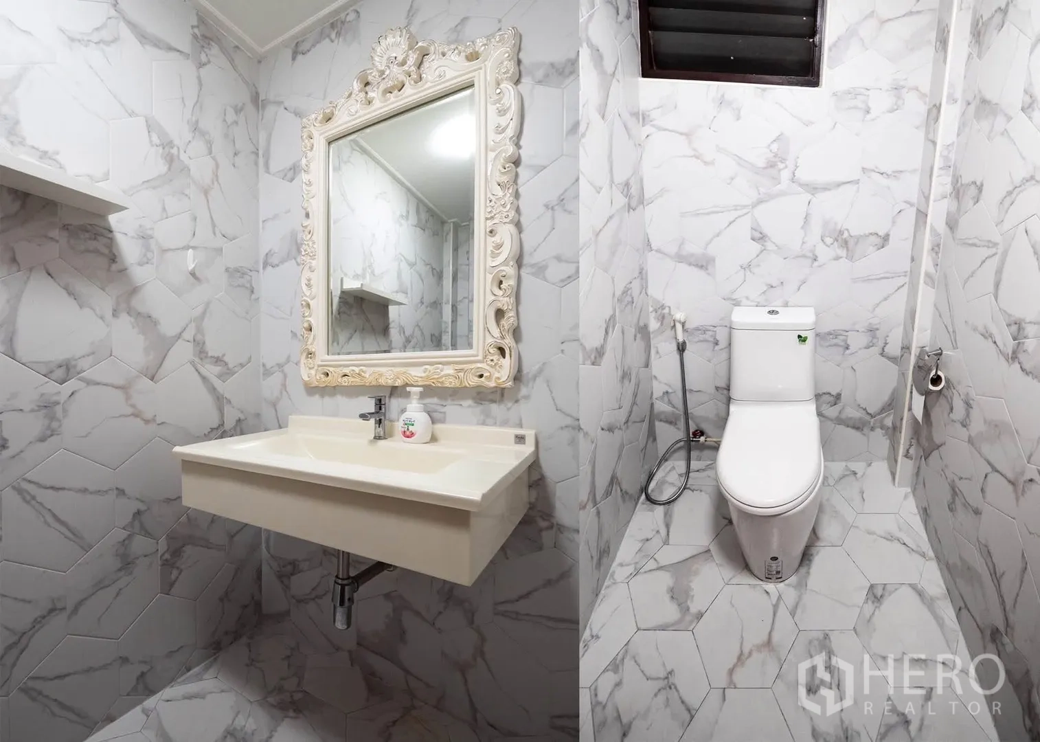Townhouse for rent in Watthana, Bangkok - Guest bathroom with ornate framed mirror, marble-pattern tiles, and toilet.