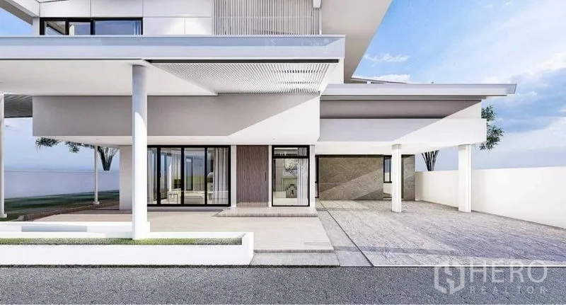 独立式住宅 出租在Lat Phrao, Bangkok - 带顶车棚与主入口，圆柱、玻璃推拉门和门廊的当代住宅。