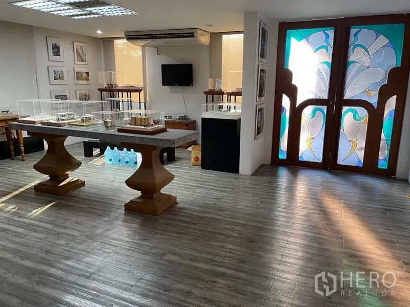Office Space for rent in Khlong Toei, Bangkok - Lobby or showroom with wood floors and stained-glass double doors.