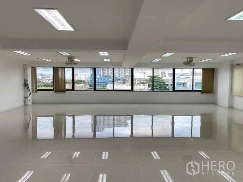 Office Space for rent in Suan Luang, Bangkok - Top-floor office with wide city views through large windows.