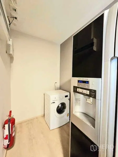 Detached House for rent or sale in Prawet, Bangkok - Light-filled stairwell with handrail and wall sconce.