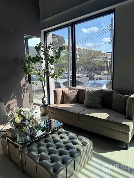 Home Office for rent in Bueng Kum, Bangkok - Street-level glass entrance of the home office with reflective panels and sliding door.