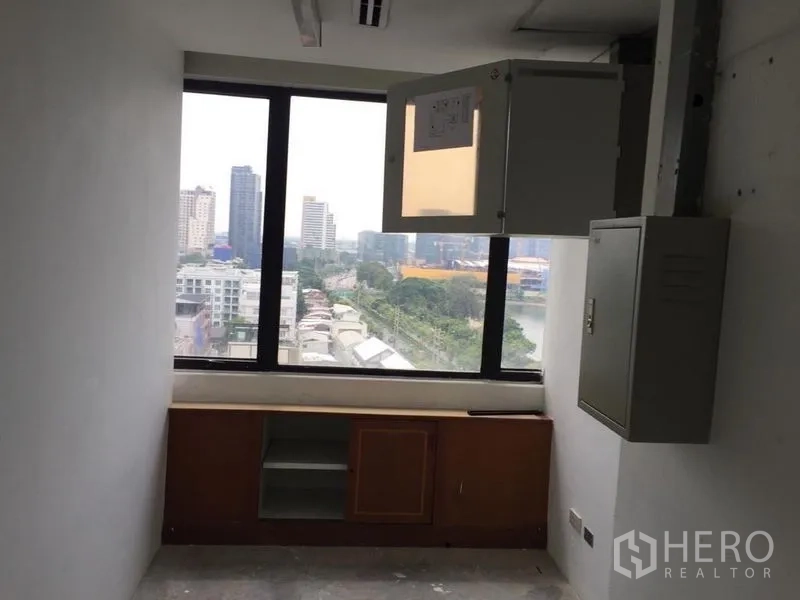 Office Space for sale in Watthana, Bangkok - Utility room with window, electrical cabinets and city outlook.
