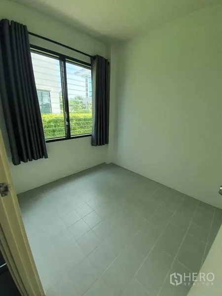 Detached House for sale in Bang Khun Thian, Bangkok - Compact bedroom or study with window views, tiled floor and blackout curtains.