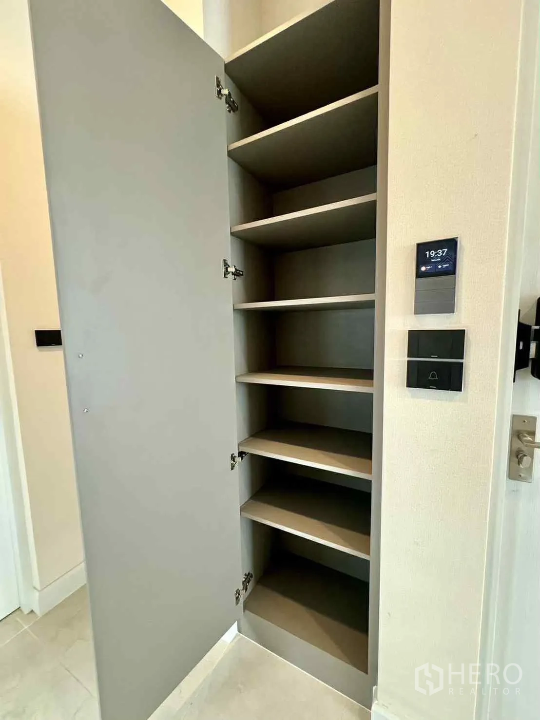 Detached House for rent in Bang Phli, Samut Prakan - Tall built-in storage cabinet with open shelves beside a wall control panel.