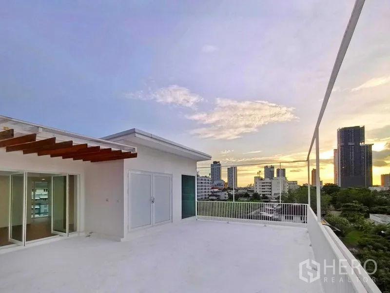 Home Office for sale in Suan Luang, Bangkok - Rooftop terrace with skyline views at sunset.