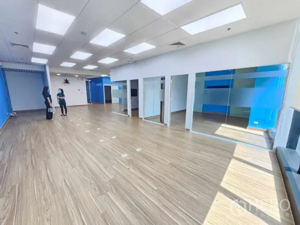Office Space for rent in Sathon, Bangkok - Spacious office floor with glass partitions and floor boxes under bright ceiling lights.