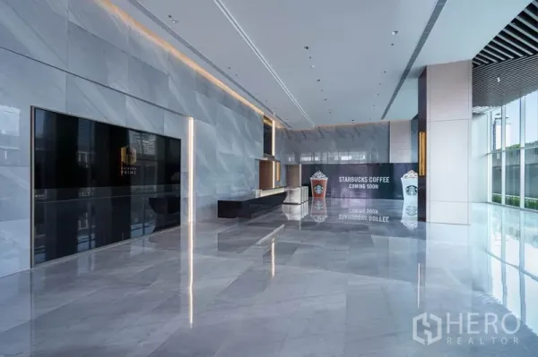 Office Space for rent in Sathon, Bangkok - Spacious marble-clad main lobby with reception desk and floor-to-ceiling glass.