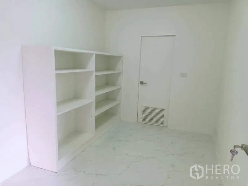 Condominium for  in Watthana, Bangkok - Storage room with white shelving and marble-look floor.