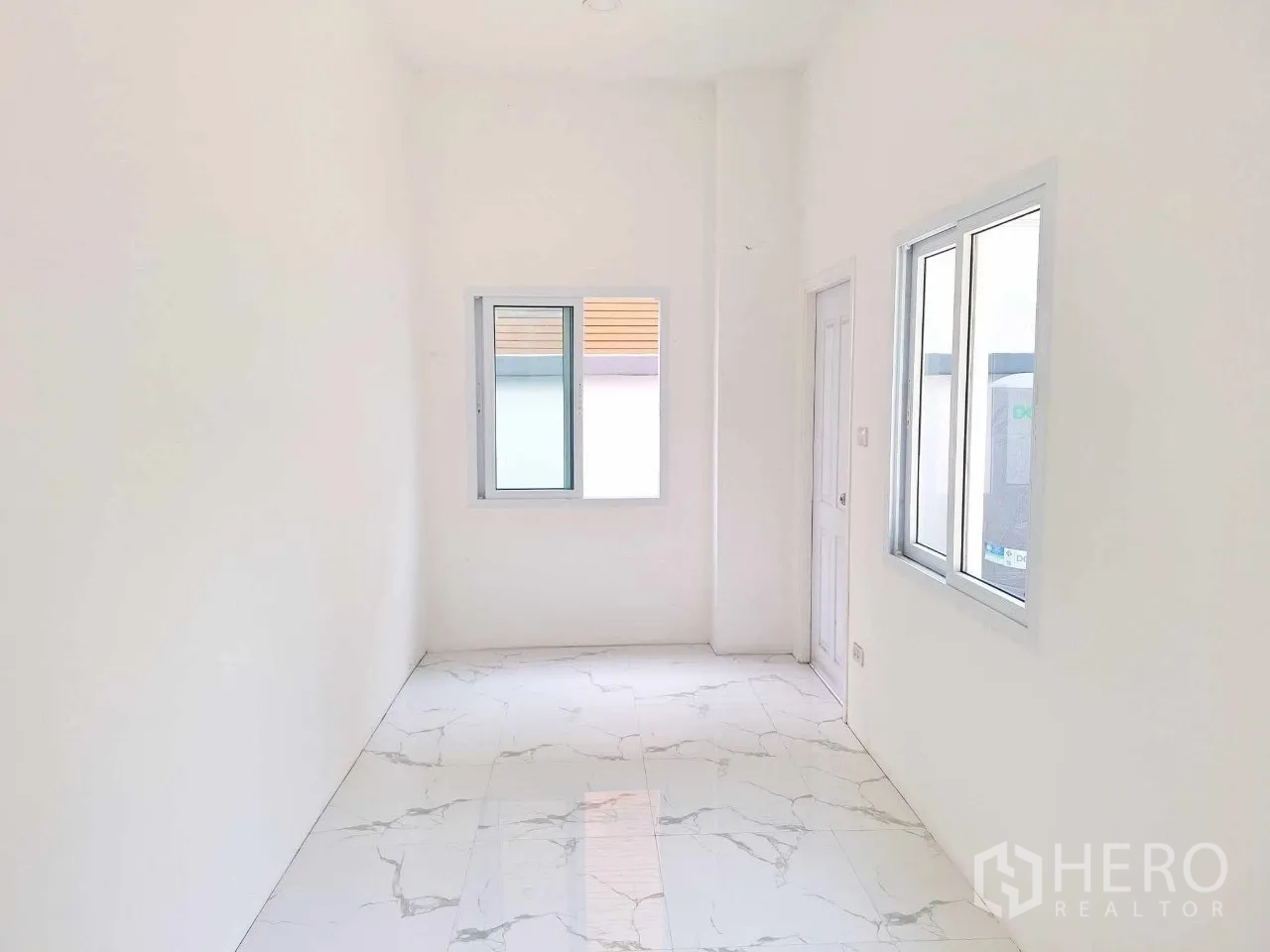 Office Space for sale in Bueng Kum, Bangkok - Small office or staff room with marble flooring and windows.