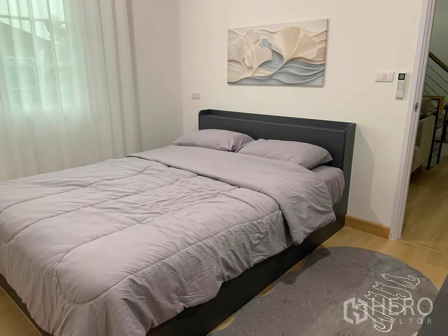 Detached House for rent in Bang Phli, Samut Prakan - Cozy bedroom with a double bed, wall art and sheer curtains.
