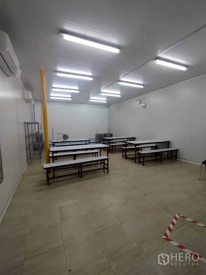 Factory for rent or sale in Mueang Nakhon Pathom, Nakhon Pathom - Staff canteen with long dining tables and bright overhead lighting.