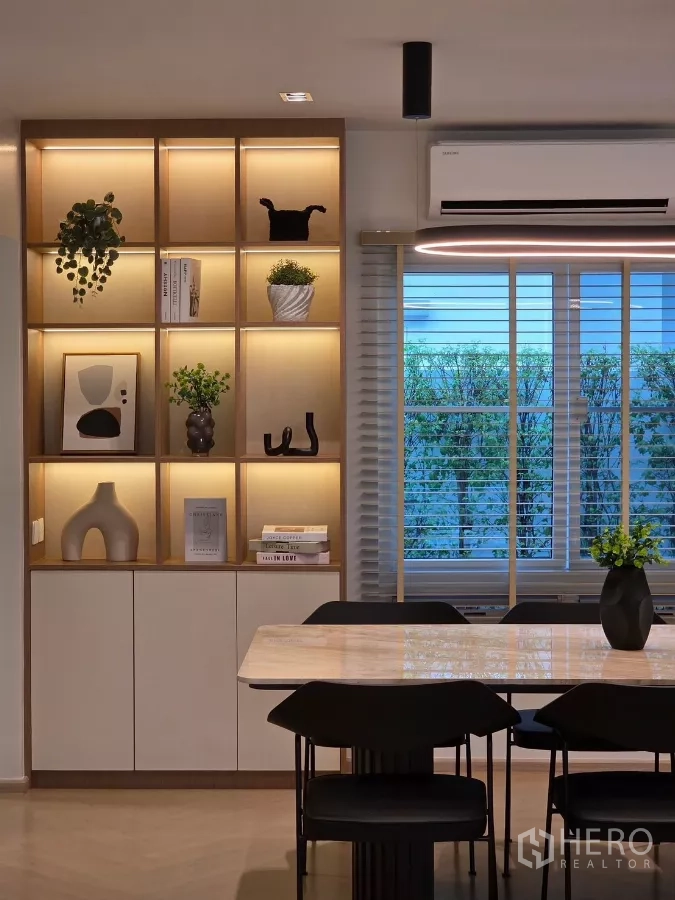 Detached House for rent in Bang Phli, Samut Prakan - Close-up of dining zone with illuminated built-in shelves and window blinds.