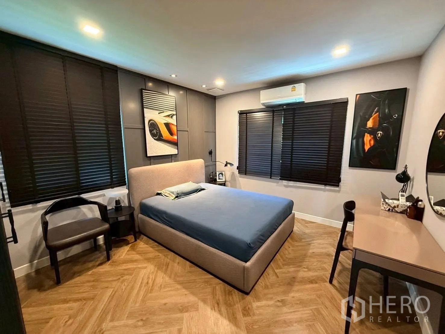 Detached House for rent in Bang Phli, Samut Prakan - Bedroom with double bed, dark blinds, desk, and herringbone wood floor.