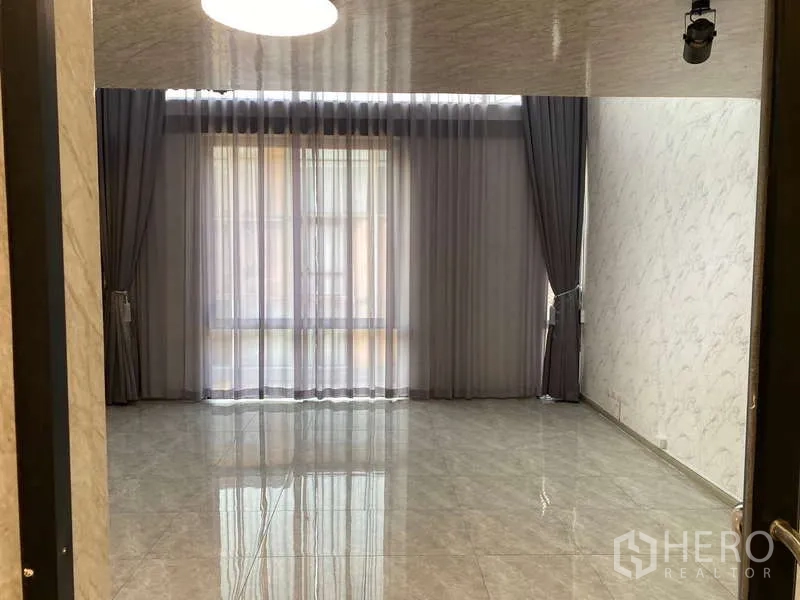 Home Office for rent or sale - Polished tile multipurpose room with wide window and sheer curtains letting in natural light.