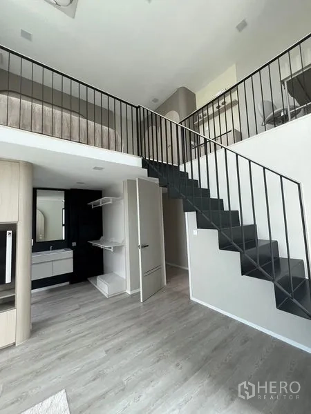 Detached House for rent in Saphan Sung, Bangkok - Mezzanine level with open stair and built-ins overlooking the lower living space.