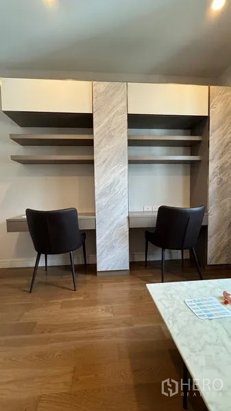 Detached House for rent in Prawet, Bangkok - Built-in double workstation with open shelves and two chairs in a study area.