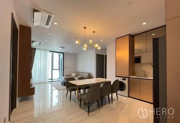 Condominium for rent or sale in Sathon, Bangkok - Another angle of the open-plan living, dining and kitchen with balcony access.