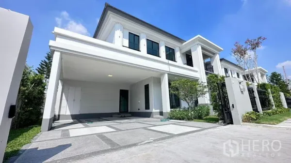 Detached House for rent or sale - Contemporary two-storey house exterior with covered parking, gated entry and neat front lawn.