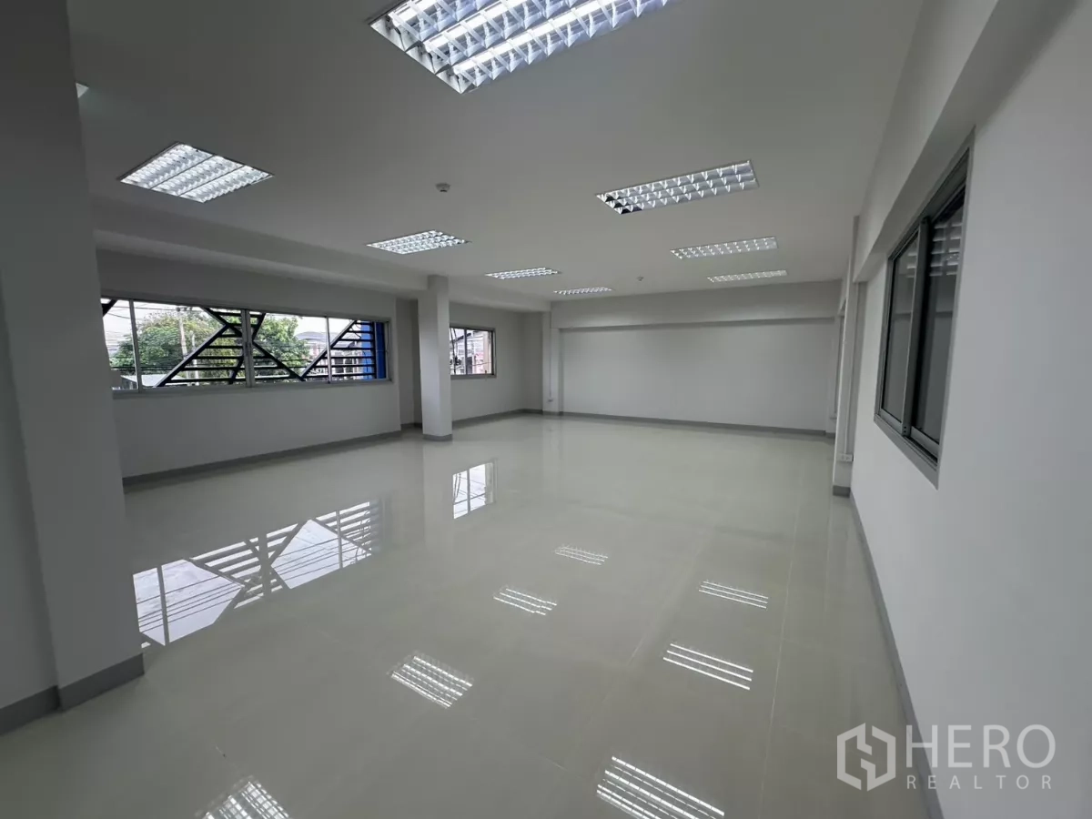 Factory for rent in Bang Phli, Samut Prakan - Another angle of the first-floor office showing wide windows and glossy tiles.