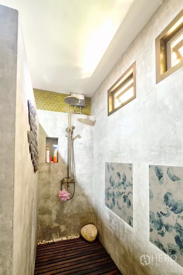 Detached House for sale in Bang Lamung, Chon Buri - Walk-in rain shower with niche shelving, pebble accents, and high windows.