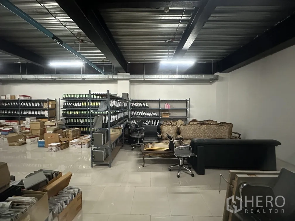 Factory for rent in Lam Luk Ka, Pathum Thani - Archive and storage room with metal shelving and boxed inventory.