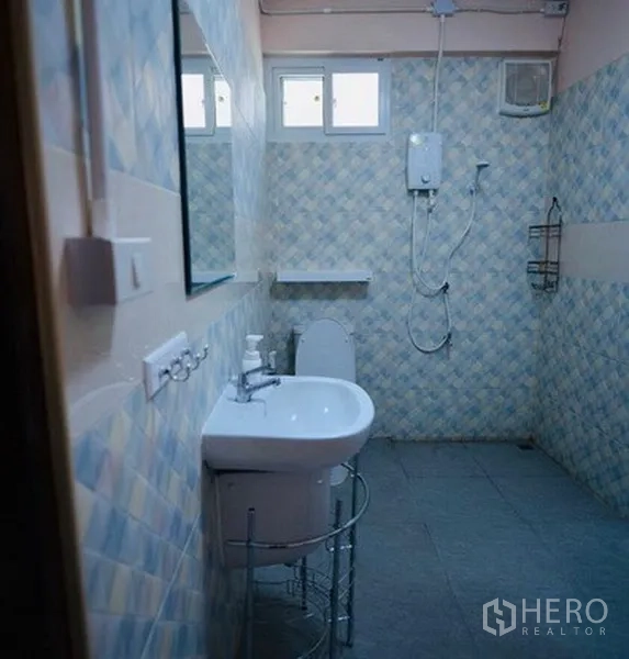 Detached House for rent in Bang Na, Bangkok - Tiled bathroom with walk-in shower, electric water heater and basin.